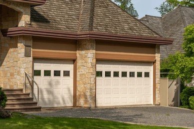 garage-door-luxury-house-trees-260nw-2646053459